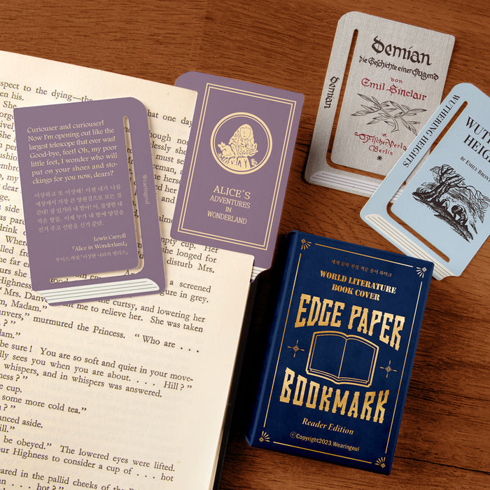 Contents of Wearingeul Edge Paper Bookmarks Reader Edition displayed with multiple bookmark designs beside reading material.