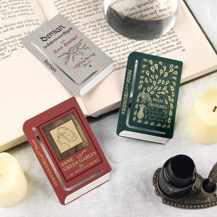 Wearingeul Edge Paper Bookmarks Reader Edition featuring Anne of Green Gables and Les Fleurs du Mal designs placed in open books.