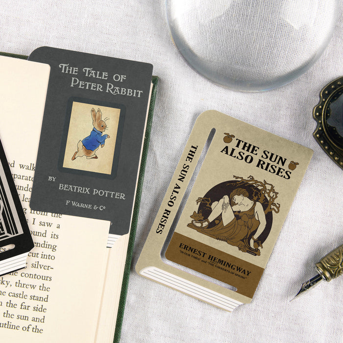 Wearingeul Edge Paper Bookmarks Reader Edition showing The Tale of Peter Rabbit and The Sun Also Rises bookmarks used in vintage books.