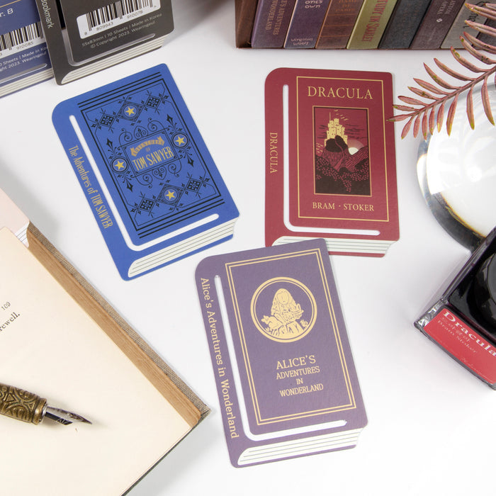 Close-up of individual Wearingeul World Literature A edge paper bookmark designs.