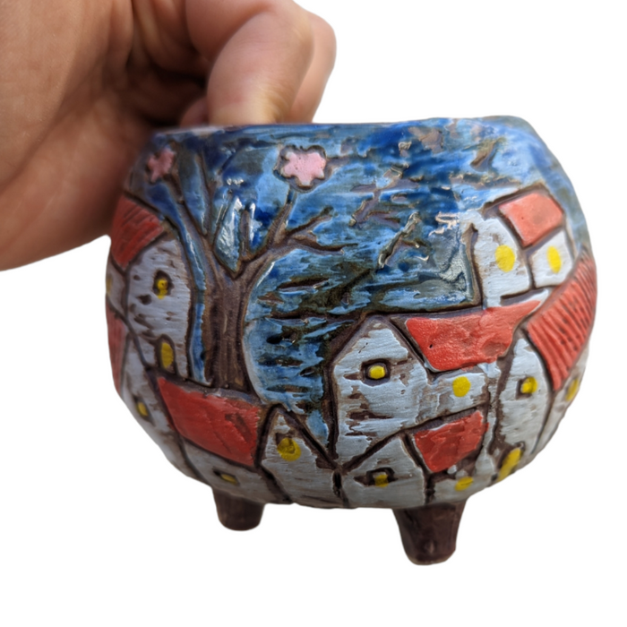 Winter Season Pot: whimsical village scene ceramic planter.