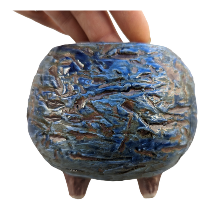 Winter Season Pot: small ceramic planter, textured, hand-held, on legs.